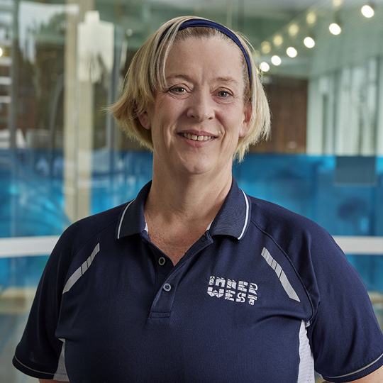  Personal trainer Anne smiling at the camera wearing a navy Inner West Council branded shirt